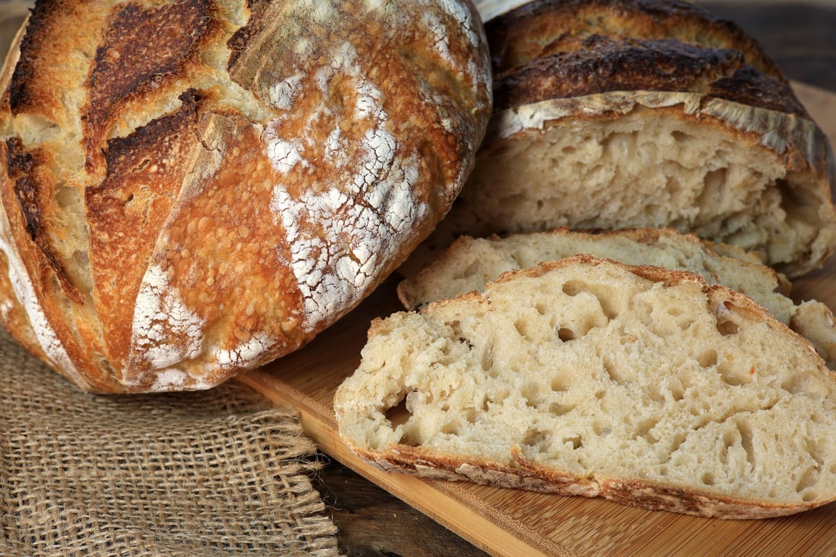 Fresh artisan sourdough boule with crispy crust